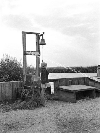 GIRL TOLLS BELL FOR FERRY